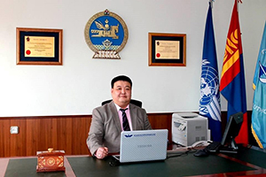 Lkhagvasuren Togtokhbayar sitting in his office at the Mongolian Civil Aviation Authority